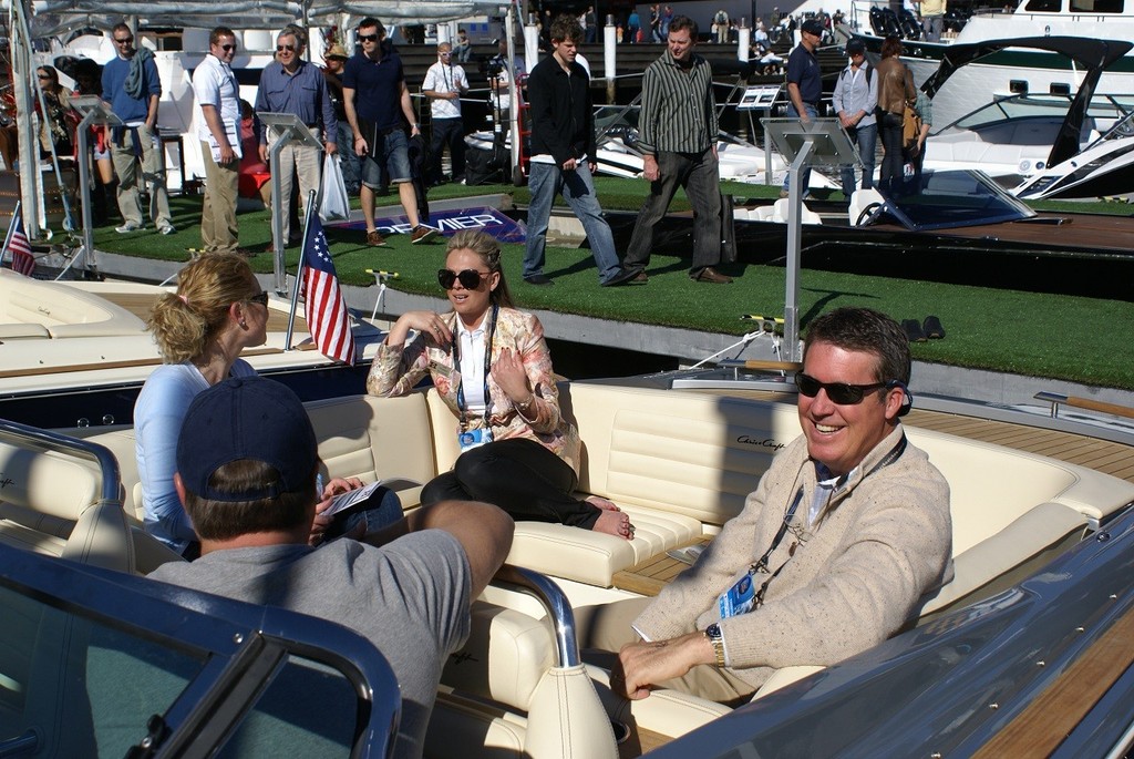Chris-Craft President Steve Heese (right), Premier Marine Operations Manager Lee Poluson (centre) explaining the virtues of Chris-Craft ownerships to prospective buyers during the Sydney International Boat Show.  - Premier Marine © Marine Queensland .